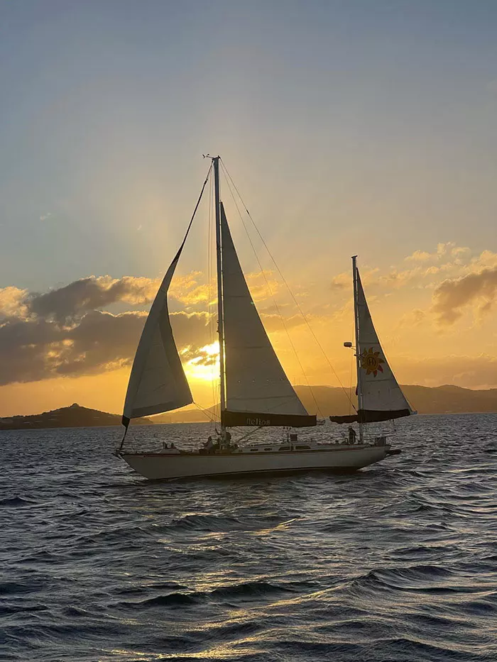 Helios sail boat at dusk out on the harbor of the USVI