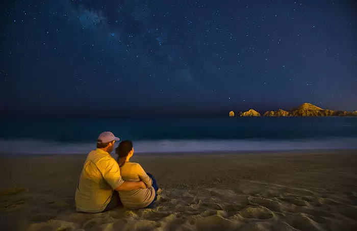 couple on beach at night in Cabo San Lucas, Mexico